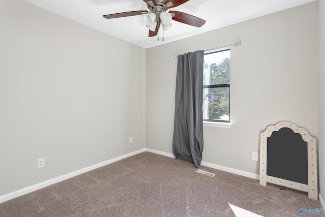 spare room with carpet flooring and ceiling fan