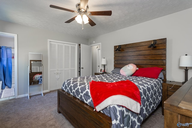 bedroom featuring dark colored carpet, a textured ceiling, a closet, and ceiling fan