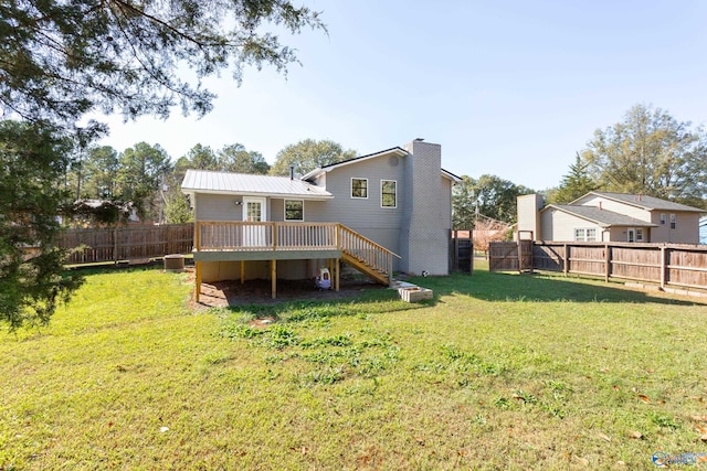 rear view of house featuring a yard, a deck, and cooling unit