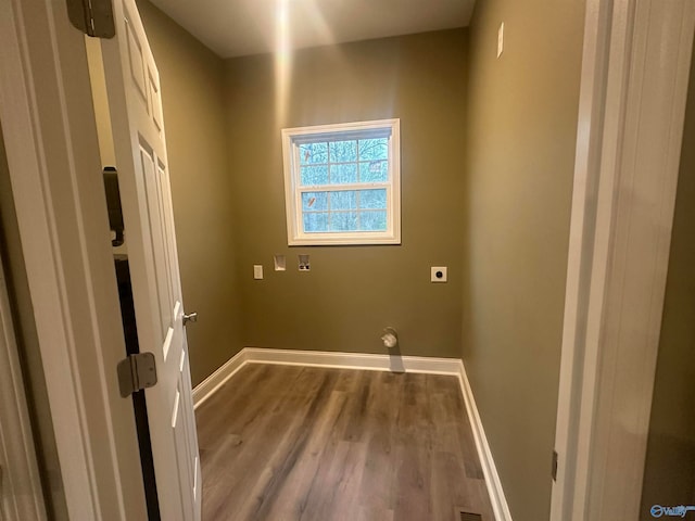 laundry room with electric dryer hookup and hardwood / wood-style flooring