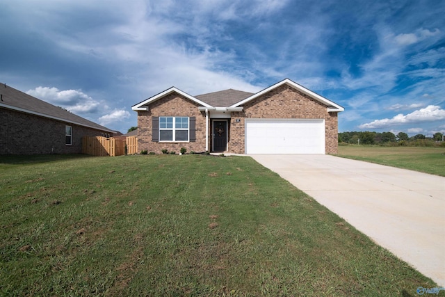 view of front of property with a garage and a front lawn