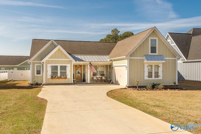 23276 Saint John Rd, Athens, AL 35613 - view of front of home featuring fence, an attached garage, concrete driveway, a front yard, and a shingled roof