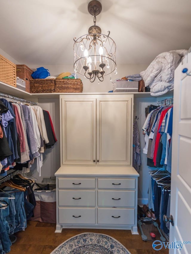 23276 Saint John Rd, Athens, AL 35613 - walk in closet with a notable chandelier and dark wood finished floors