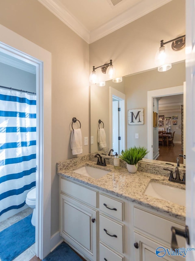 23276 Saint John Rd, Athens, AL 35613 - bathroom with toilet, double vanity, a sink, and crown molding