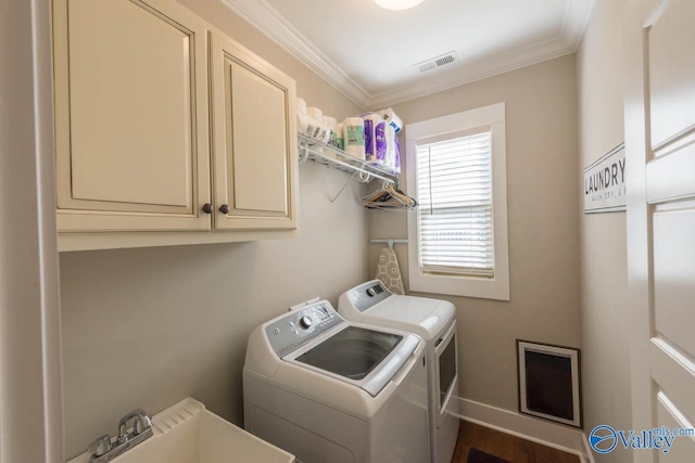23276 Saint John Rd, Athens, AL 35613 - clothes washing area featuring visible vents, ornamental molding, a sink, cabinet space, and separate washer and dryer