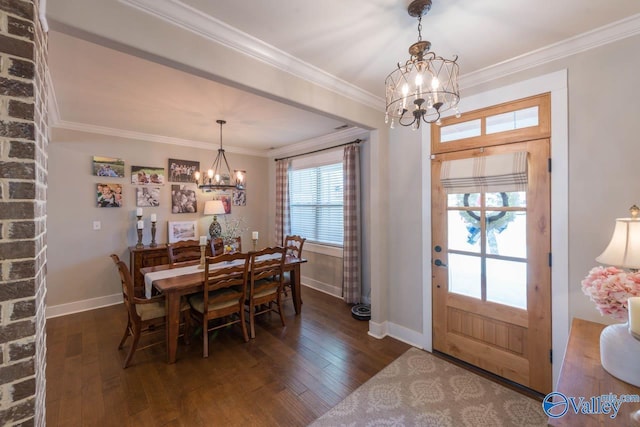 23276 Saint John Rd, Athens, AL 35613 - dining area featuring an inviting chandelier, ornamental molding, dark wood-type flooring, and baseboards
