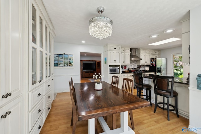 7734 Upper Snake Rd, Athens, AL 35614 - dining area with baseboards, recessed lighting, light wood-style flooring, and a notable chandelier