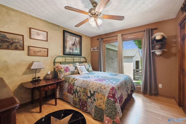 7734 Upper Snake Rd, Athens, AL 35614 - bedroom featuring ceiling fan, baseboards, access to outside, and light wood-style flooring
