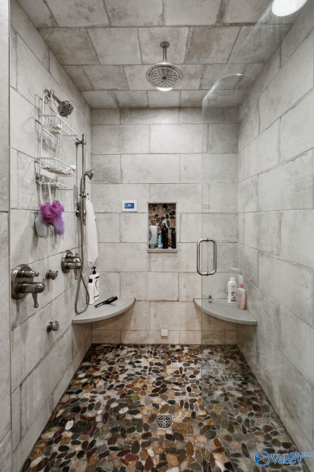 7734 Upper Snake Rd, Athens, AL 35614 - bathroom with stone floors and a stall shower