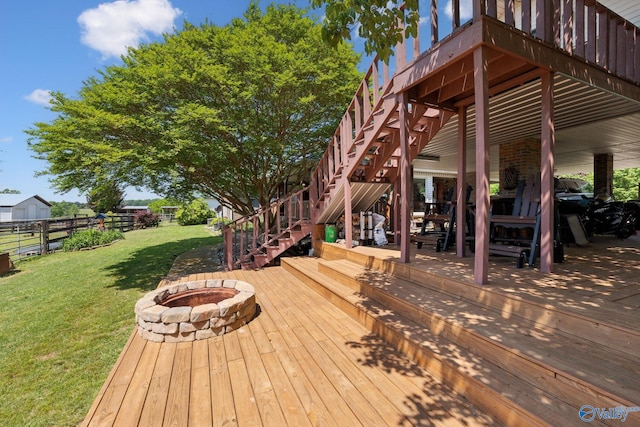 7734 Upper Snake Rd, Athens, AL 35614 - deck with a lawn, an outdoor fire pit, fence, and stairway