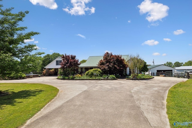 7734 Upper Snake Rd, Athens, AL 35614 - view of front of house with curved driveway, metal roof, and a front yard