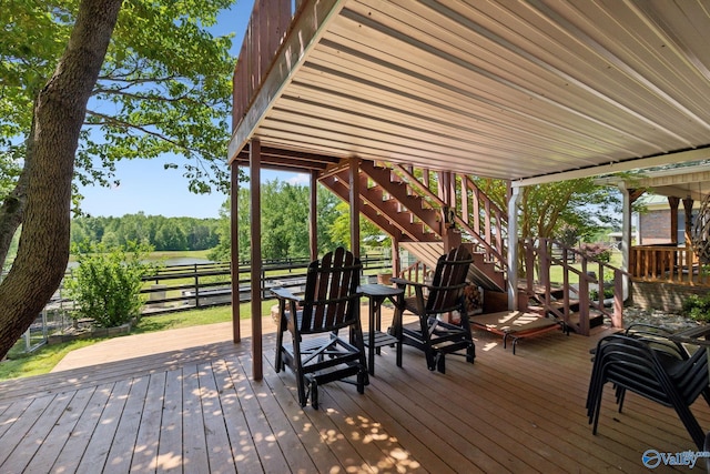 7734 Upper Snake Rd, Athens, AL 35614 - deck with fence, stairs, and a water view