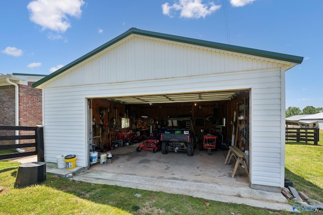 7734 Upper Snake Rd, Athens, AL 35614 - detached garage featuring fence and cooling unit