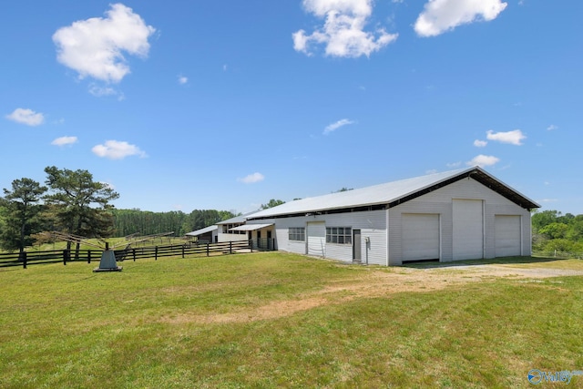 7734 Upper Snake Rd, Athens, AL 35614 - exterior space featuring a garage, fence, and an outbuilding