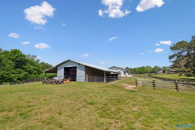7734 Upper Snake Rd, Athens, AL 35614 - view of yard featuring an exterior structure and an outbuilding