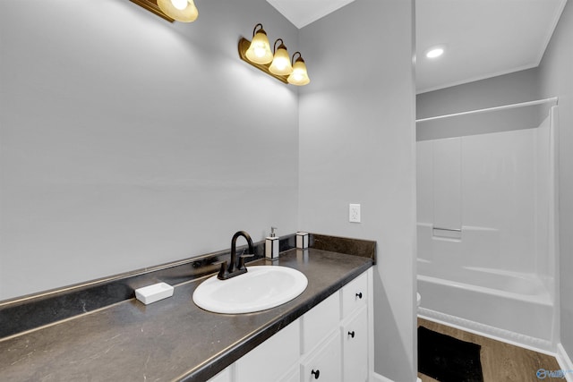 full bathroom with vanity, ornamental molding, toilet, and shower / bath combination