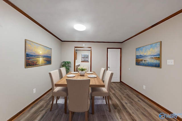 dining space featuring ornamental molding, baseboards, and dark wood finished floors