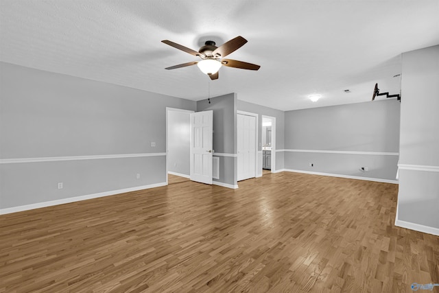 unfurnished room featuring light hardwood / wood-style flooring and ceiling fan