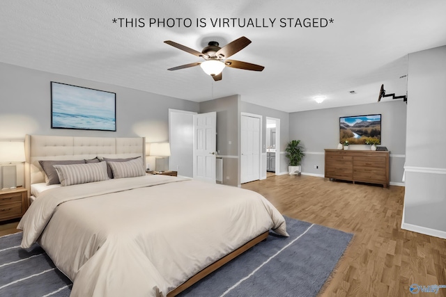 bedroom featuring ceiling fan and light hardwood / wood-style floors