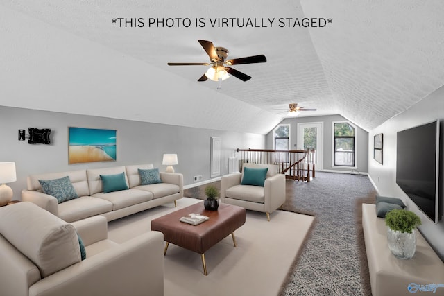 living room with a textured ceiling, carpet floors, ceiling fan, and lofted ceiling