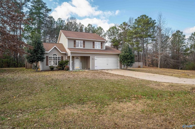 traditional-style home with a garage, a front yard, and driveway