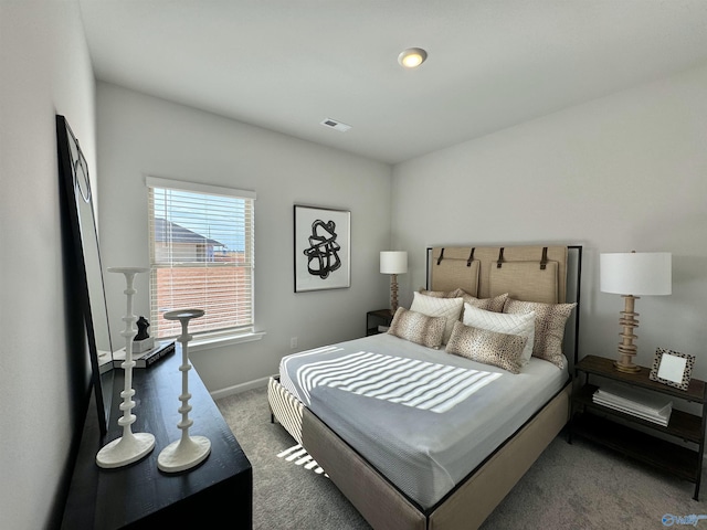 bedroom featuring visible vents, baseboards, and carpet floors