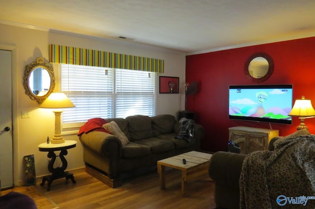 living room featuring crown molding and wood-type flooring