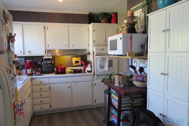 kitchen with white cabinets and dark hardwood / wood-style floors