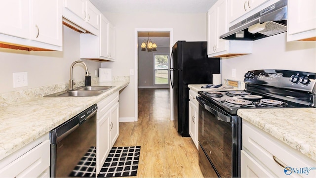 kitchen with sink, light hardwood / wood-style flooring, white cabinets, and black appliances