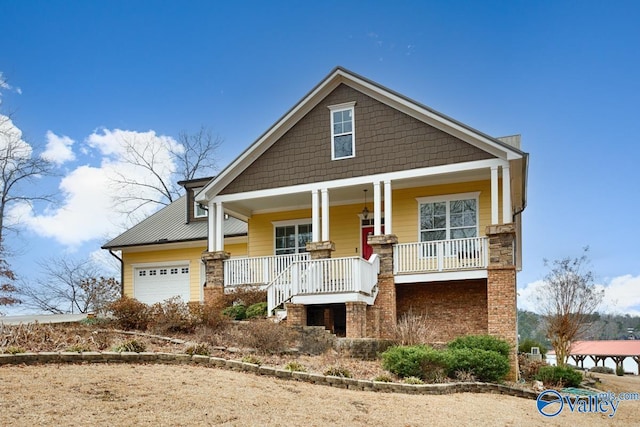 craftsman inspired home featuring a garage and a porch