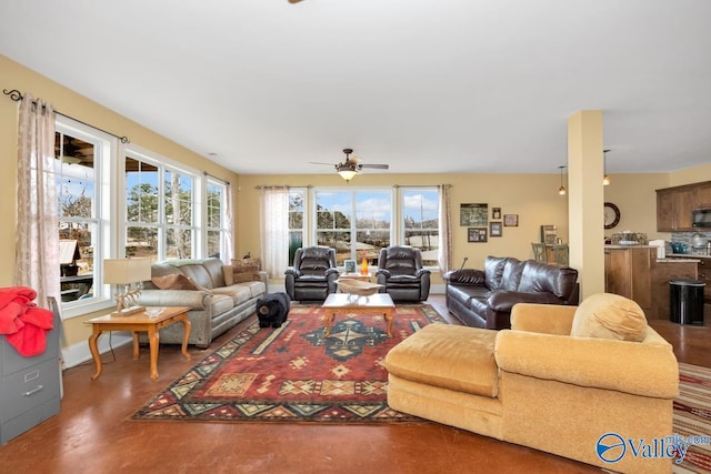 living room with concrete flooring and ceiling fan