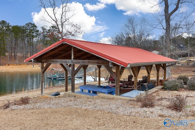 view of property's community featuring a water view and a dock