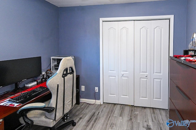 office area with light hardwood / wood-style floors