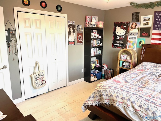 bedroom featuring a closet and light hardwood / wood-style floors