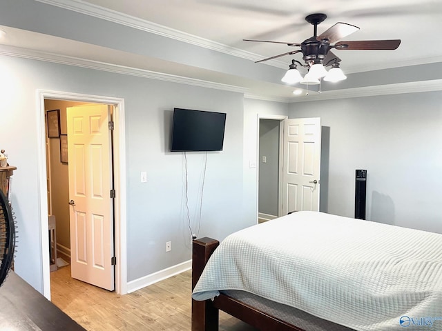 bedroom featuring ceiling fan, light hardwood / wood-style flooring, and crown molding