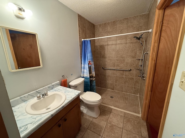 4435 Pilgrims Rest Rd, Southside, AL 35907 - bathroom featuring vanity, tiled shower, a textured ceiling, and tile patterned flooring