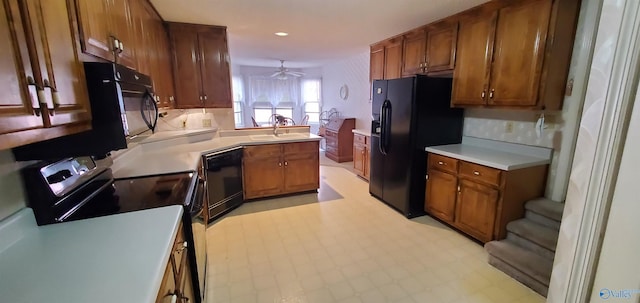 kitchen featuring light tile patterned flooring, sink, ceiling fan, and black appliances