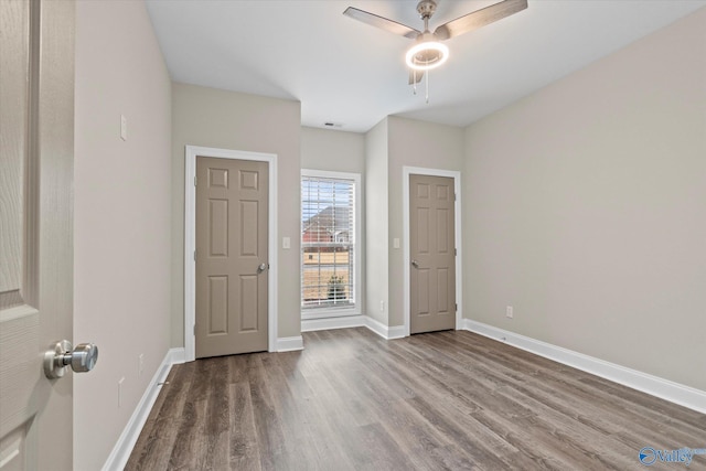 unfurnished bedroom with hardwood / wood-style flooring and ceiling fan