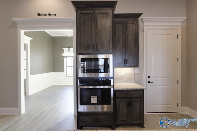 BELLEWOOD-B Mallard Dr, Madison, AL 35756 - kitchen featuring stainless steel appliances, light wood-style floors, dark brown cabinetry, a chandelier, and light stone counters