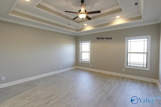 BELLEWOOD-B Mallard Dr, Madison, AL 35756 - spare room featuring a raised ceiling, ornamental molding, ceiling fan, wood finished floors, and recessed lighting