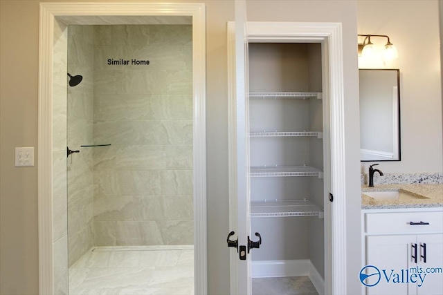 BELLEWOOD-B Mallard Dr, Madison, AL 35756 - full bathroom featuring vanity and a tile shower
