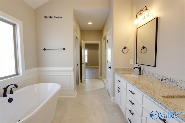 BELLEWOOD-B Mallard Dr, Madison, AL 35756 - full bathroom with a freestanding bath, double vanity, and a wainscoted wall