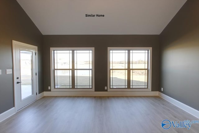 BELLEWOOD-B Mallard Dr, Madison, AL 35756 - unfurnished room with vaulted ceiling, wood finished floors, and plenty of natural light