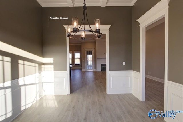 BELLEWOOD-B Mallard Dr, Madison, AL 35756 - unfurnished dining area featuring a chandelier, wood finished floors, crown molding, and a wainscoted wall