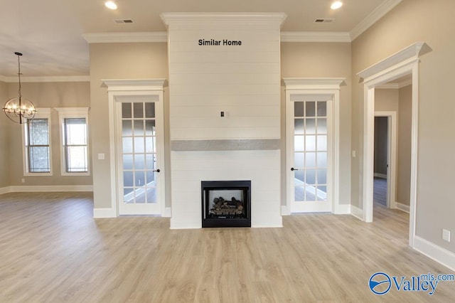 BELLEWOOD-B Mallard Dr, Madison, AL 35756 - unfurnished living room featuring wood finished floors, ornamental molding, a chandelier, and a fireplace