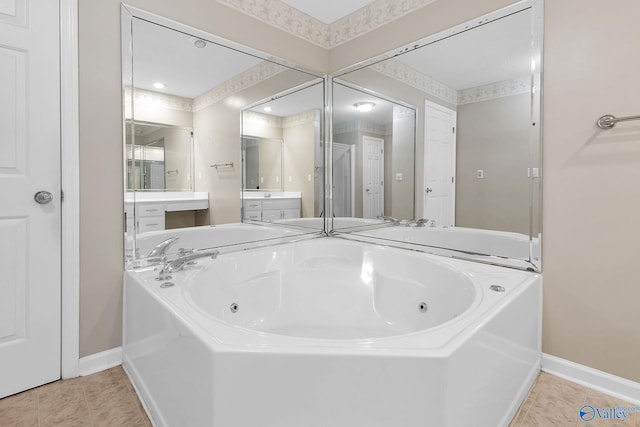 bathroom featuring vanity, a tub, and tile patterned floors