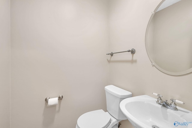 bathroom featuring sink and toilet