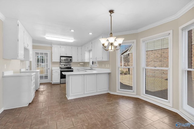 kitchen with appliances with stainless steel finishes, decorative light fixtures, white cabinets, kitchen peninsula, and an inviting chandelier