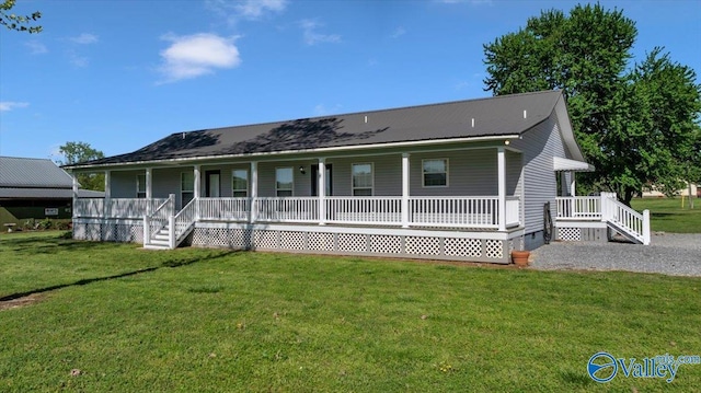 view of front of house featuring a porch, crawl space, a front lawn, and metal roof