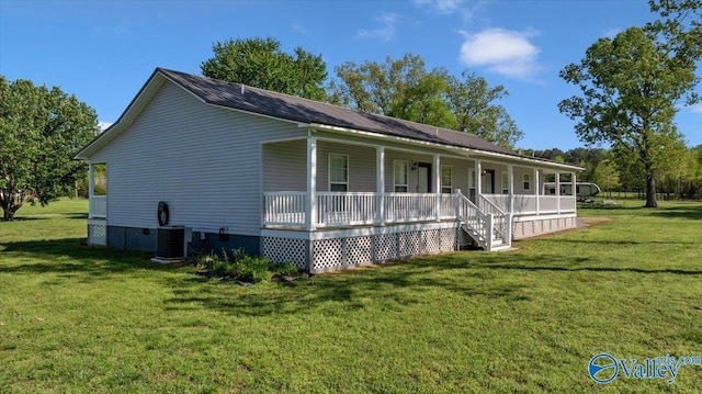 exterior space with a porch, crawl space, cooling unit, and a front lawn